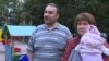 Pyotr and Yelena Khomsky, shown with their three-month-old daughter, speak with Current Time on August 26, 2019.