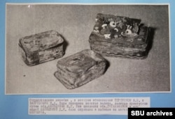 Metal boxes uncovered from the grave of Sheynkyn's late wife. The boxes were filled with gold coins.