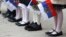 Russia -- Pupils hold the Russian flags during a Knowledge Day ceremony