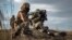 UKRAINE – In this image released by Ukrainian Defense Ministry Press Service, Ukrainian soldiers use a launcher with US Javelin missiles during military exercises in Donetsk region, December 23, 2021