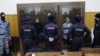 Кирилл Суханов, Ариан Романовский (Кузьмин) и Тамерлан Бигаев в зале суда