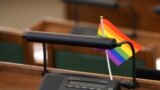 Latvian MP seat decorated with Rainbow Flag 