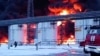 RUSSIA – In this photo taken from video released by Governor of Bryansk Region Alexander Bogomaz telegram channel AV BogomaZ on 19Jan.2024, Russian Emergency Ministry employees work at the side of fire of oil reservoirs after the drone reached Klintsy