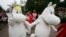 Moomin characters meet visitors at Moomin World theme park in Naatali