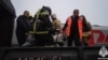 Seen in this video screen grab is an operation by rescue workers to evacuate passengers from a Vorkuta-to-Novorossiysk 