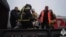 Seen in this video screen grab is an operation by rescue workers to evacuate passengers from a Vorkuta-to-Novorossiysk 