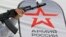 CRIMEA – A woman holds a mock-up of an AK-74 Kalashnikov assault rifle at a mobile recruitment centre, Simferopol, 15Apr2023