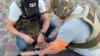 Detention allegedly of members of Russian GRU sabotage and reconnaissance group. Photo by SBU. 8 August 2022