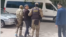 Kazakhstan -- People in camouflage uniforms are leading Aidar Syzdykov, clasping his arms, towards an unmarked bus. Astana, 16May2024