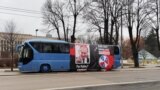 Bus with Putin depiction outside of Russian embassy in Riga