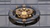 RUSSIA -- A statue of Themis, an ancient Greek Goddess of Justice, and a Russian national state emblem are seen at the entrance of Russia's Supreme Court in Moscow on November 30, 2023