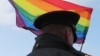 RUSSIA -- A law enforcement officer stands guard during the LGBT community rally "X St.Petersburg Pride" in central Saint Petersburg, Russia August 3, 2019. 
