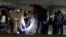 Spanish Civil Guard officers investigate the garage where the body of Russian pilot Maxim Kuzminov was found after he was shot dead