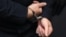 GERMANY -- Stephan Balliet, who is accused of shooting dead two people after an attempt to storm a synagogue in Halle an der Saale, eastern Germany, has his hands cuffed as he arrives into the courtroom 