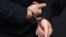 GERMANY -- Stephan Balliet, who is accused of shooting dead two people after an attempt to storm a synagogue in Halle an der Saale, eastern Germany, has his hands cuffed as he arrives into the courtroom 
