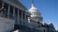 A person stands outside the U.S. Capitol, before a vote to begin work on a bill that includes aid for Ukraine, Israel and Taiwan in Washington in U.S. Senate, U.S., February 9, 2024. REUTERS/Nathan Howard