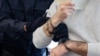 GERMANY -- Defendant Abdul Majed R (R) is led in handcuffs into the courtroom of the Higher Regional Court in Dresden