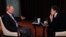 Russia's President Vladimir Putin (L) answers questions of ARD channel's representative Hubert Seipel 