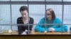 Женя Беркович (слева) и Светлана Петрийчук участвуют в заседании Мосгорсуда 30 ноября 2023 года по видеосвязи из СИЗО
