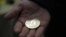 RUSSIA ECONOMY CRYPTOCURRENCY --  A visitor holds a Bitcoin (virtual currency) souvenir coin, during a webinar by Russian businessman, Orthodox activist and founder the Crypto exchange CryptoSterlingClub Alisa, German Sterligov at the main office of Crypt