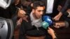 BULGARIA -- Severin Krasimirov, the suspect arrested in the rape and slaying of a Bulgarian television journalist, speaks with reporters prior to his first appearance in court in Ruse, October 19, 2018