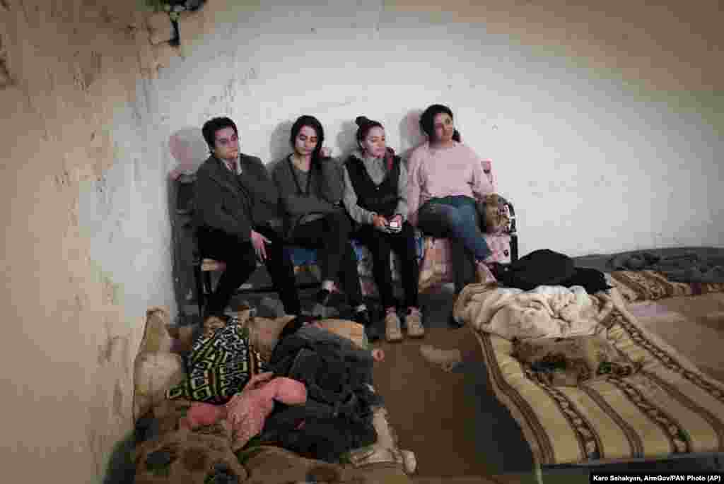 Ethnic Armenian women take shelter from gunfire in a bomb shelter in Stepanakert (Khankendi), the main town in the disputed region of Nagorno-Karabakh.