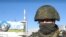 Военнослужащий на территории Чернобыльской атомной электростанции. Подразделения Воздушно-десантных войск России обеспечивают охрану Чернобыльской атомной электростанции (АЭС), 26 февраля 2022 года