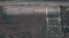 "Схемы": на спутниковых снимках нашли 300-метровую братскую могилу в оккупированном войсками РФ селе Мангуш вблизи Мариуполя 