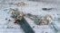 UKRAINE – Parts of a Russian cruise missile shot down by the Ukrainian Air Defence Forces, amid Russia's attack on Ukraine, are seen in a field in Kyiv region, Ukraine December 5, 2022