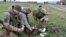 UKRAINE – Ukrainian soldiers feed cats with the Russian dry rations on Snake Island in the Black Sea, Dec. 18, 2022