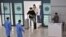 Health workers guide travellers arriving from China to a Covid-19 testing centre at Incheon International Airport, west of Seoul on January 3, 2023