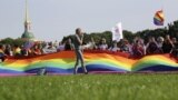 People take part in the LGBT (lesbian, gay, bisexual, and transgender) community rally "VIII St.Petersburg Pride" in St. Petersburg, Russia August 12, 2017. REUTERS/Anton Vaganov