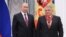 Russia's President Vladimir Putin (L) awards Kurchatov Institute Director Mikhail Kovalchuk
