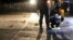 Philippines -- Scene of the Crime Operatives (SOCO) work at the scene where two suspects were shot dead following an encouter and shootout with police at a checkpoint along a highway in Manila on August 28, 2016