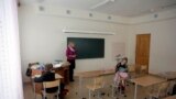 Latvia -- Inta Nogda, a teacher, holds a lesson in the primary school joint class with the few pupils in Merdzene near Karsava about 300 km (186 miles) east from capital Riga February 29, 2012.