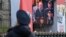 A screen shows Russian President Vladimir Putin giving a speech as servicemen line up on Red Square during the Victory Day military parade in central Moscow on May 9, 2022. - Russia celebrates the 77th anniversary of the victory over Nazi Germany during W