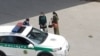 Turkmenistan. Police checks the women. Police car. Ashgabat, 2022