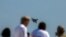 RUSSIA -- Visitors watch a demonstration flight of the Russian Mikoyan MiG-35 multirole jet fighter performing during an air show at the MAKS 2021 International Aviation and Space Salon, in Zhukovsky, outside Moscow, on July 20, 2021