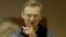RUSSIA -- Russian opposition leader Aleksei Navalny, charged with defaming a World War II veteran, gestures from inside a glass cell during a court hearing in Moscow, February 16, 2021