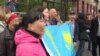 Kazakhstan - supporters demand the release of activists jailed for protest banner for fair elections during Almaty marathon - screen grab