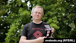 Олег Рудаков с медалью БНР, 2019 год