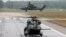 Germany -- A German Bundeswehr armed forces NH 90 helicopter (bottom) and a Tiger attack helicopter are seen during a drill for the upcoming ILA Berlin Air Show at Holzdorf Air Base, south of Berlin, May 25, 2016