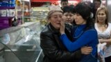 Russia -- Tumar Kasimova, from Uzbekistan, tearfully reunites with her daughter, Bakiya, who says she was kept captive as a slave laborer in Moscow for ten years
