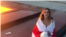 Minsk woman who received two years of chemistry for a video with a white-red-white flag
