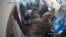 Russia - Screenshot from the surveillance camera at the delivery point of the SDEK delivery service in the city of Novozybkov, st. Komsomolskaya-12. Russian soldiers send parcels. 6Apr2022