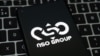 NSO Group logo seen on the smartphone placed on laptop keyboard. Israeli company known for its Pegasus spyware for surveillance.