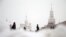 RUSSIA WEATHER SNOWFALL -- People walk on the Red Square in front of Moscow Kremlin during a snowfall in downtown Moscow, Russia, 28 December 2022