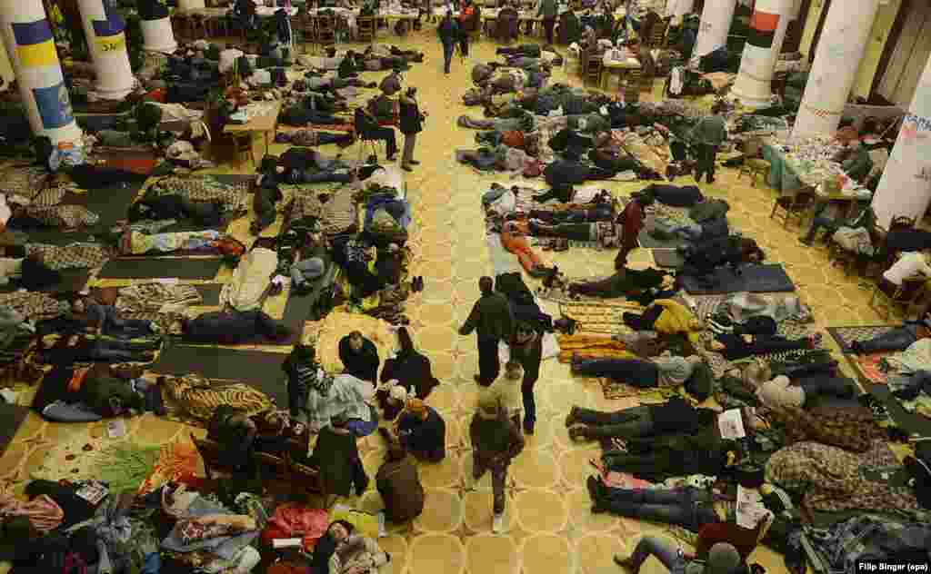Pro-European protesters sleep inside Kyiv&nbsp;City Hall on&nbsp;December 7, 2013. Thousands of protesters gathered in Kyiv to demand the government&#39;s resignation and early elections. They blocked the cabinet of ministers&#39; building and occupied a labor-union building&nbsp;and the city administration, where they had hoisted the EU flag a day earlier.