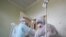 CRIMEA – A medical worker wears protective gear during the rounds in the 'red zone' at the Priboi [Swash] health resort in the city of Yevpatoria in western Crimea repurposed into a medical facility to treat COVID-19 patients, 19Oct2021