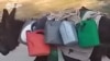 Жители Куляба жалуются на отсутствие в городе воды: некоторые запрягают ослов и возят воду из озера сами